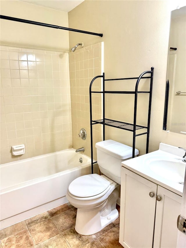 full bathroom featuring vanity, toilet, and tiled shower / bath combo