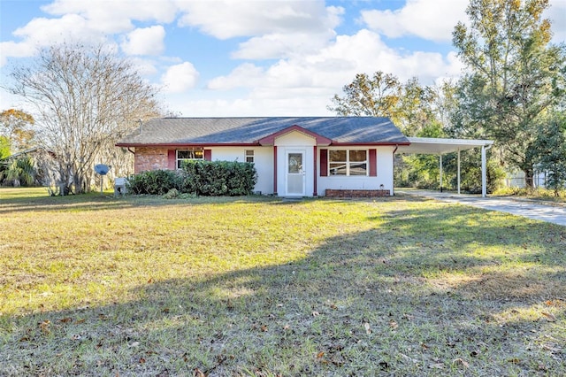 single story home with a front yard and a carport