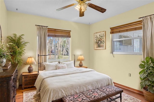 bedroom with ceiling fan and light hardwood / wood-style floors