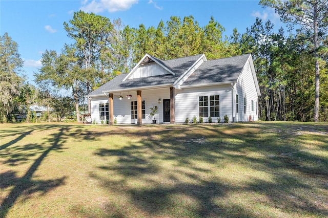 view of front of home with a porch and a front lawn