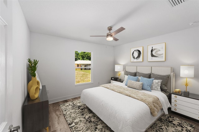 bedroom featuring ceiling fan and dark wood-type flooring