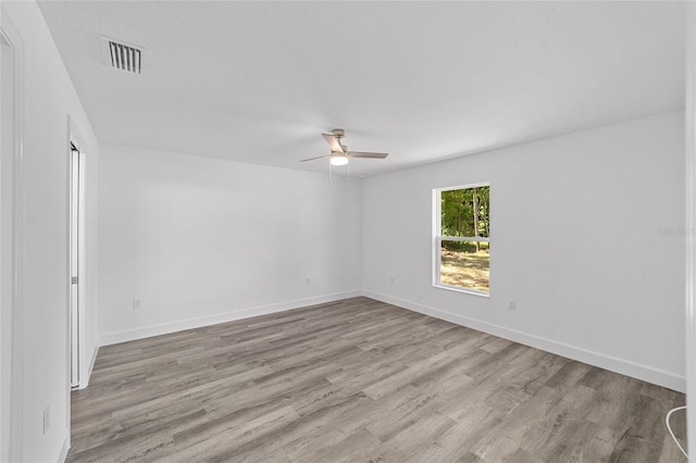 spare room with ceiling fan and light hardwood / wood-style flooring