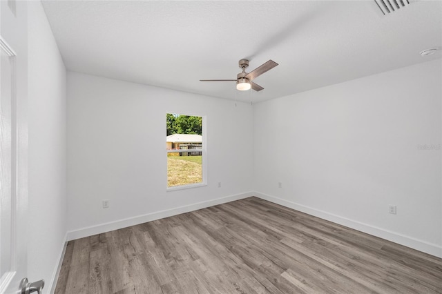 unfurnished room with light hardwood / wood-style flooring