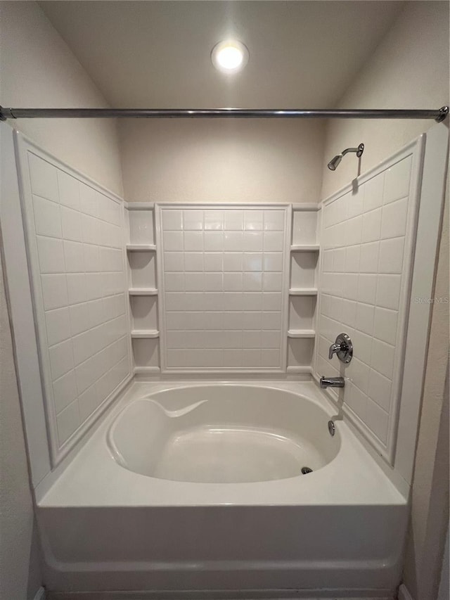 bathroom with shower / washtub combination