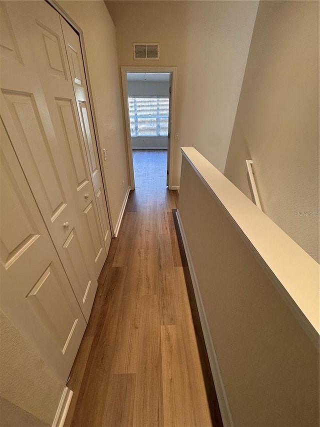 corridor featuring light hardwood / wood-style flooring