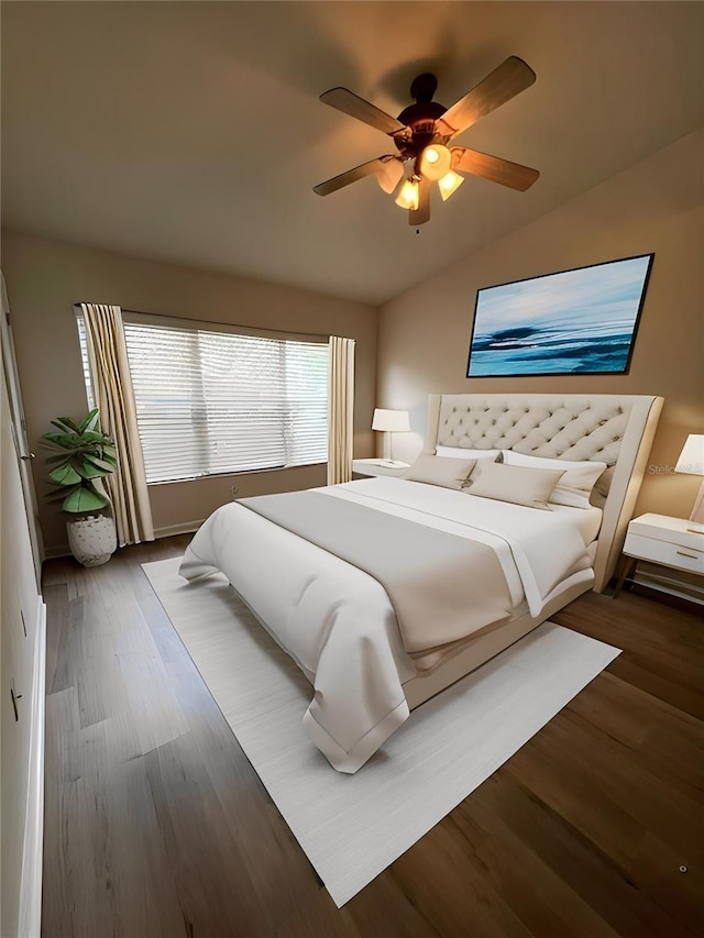 bedroom with ceiling fan, vaulted ceiling, and dark hardwood / wood-style floors