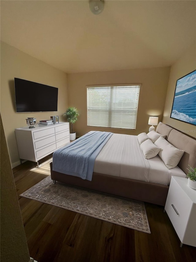 bedroom featuring dark hardwood / wood-style flooring