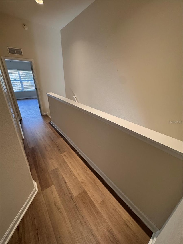 hallway with wood-type flooring