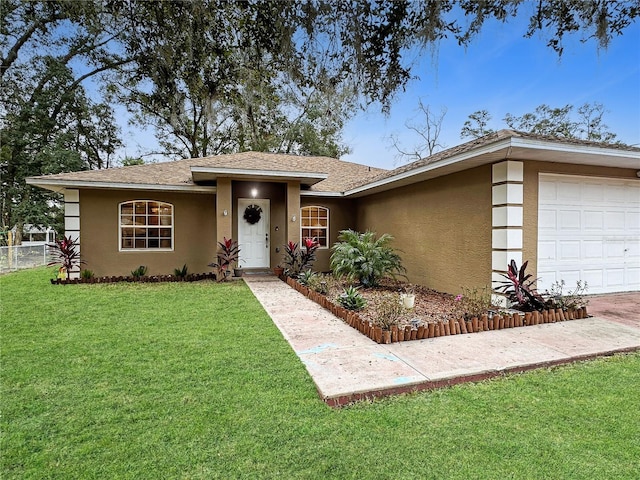 view of front facade featuring a front yard and a garage