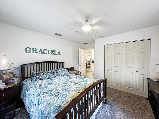 carpeted bedroom featuring a closet and ceiling fan