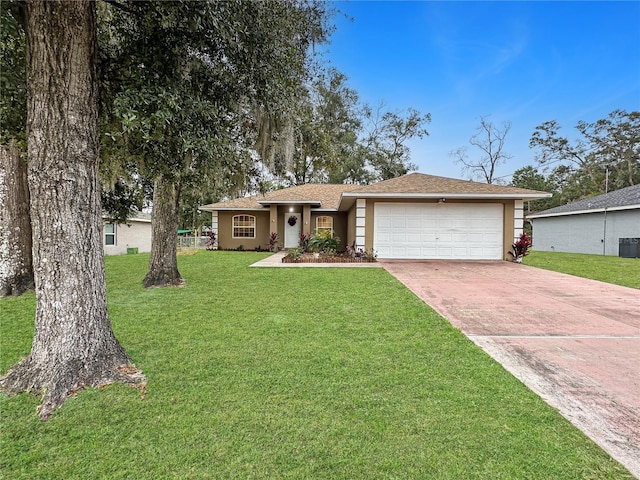 ranch-style house featuring a garage, a front lawn, and cooling unit