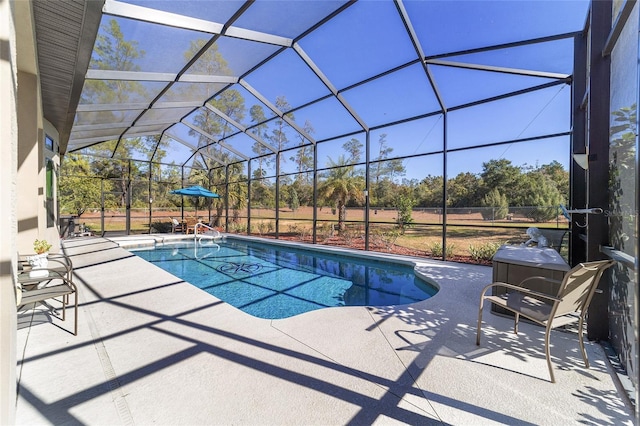 view of pool with a lanai and a patio