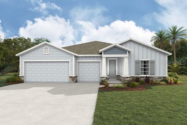 view of front of house with a front yard and a garage