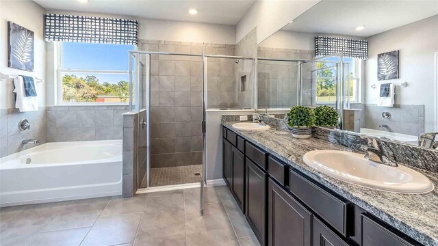 bathroom with vanity, tile patterned floors, and independent shower and bath