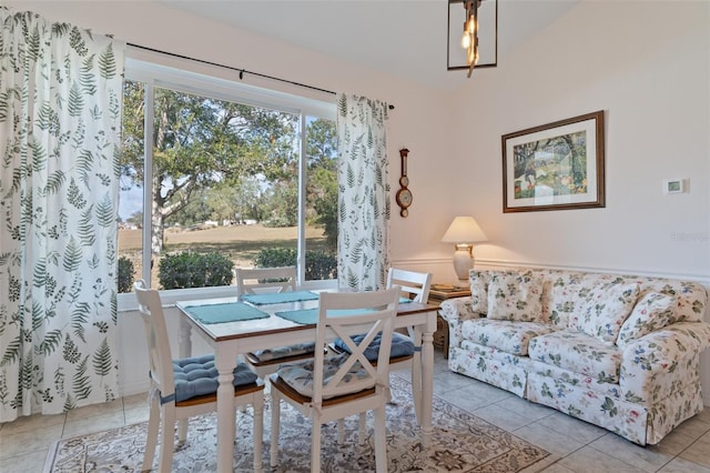 dining area featuring light tile patterned flooring