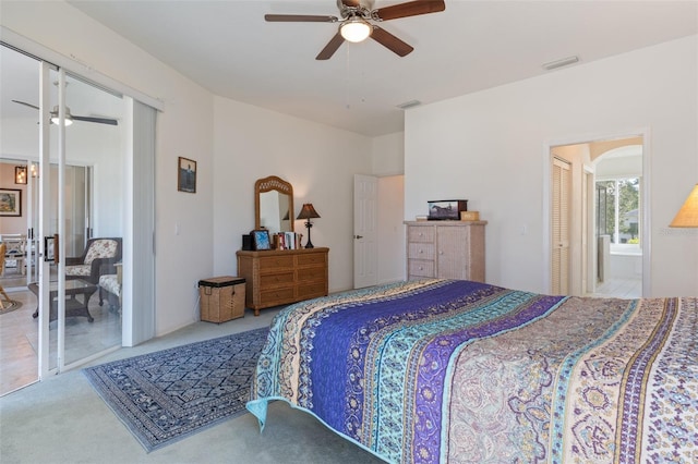 carpeted bedroom with a closet and ceiling fan