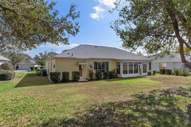 back of property featuring a yard, a sunroom, and central air condition unit