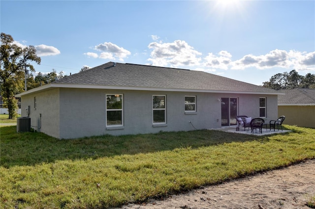 back of house featuring a yard, cooling unit, and a patio area