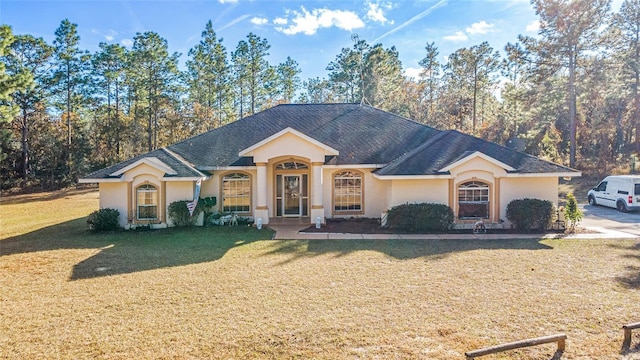 ranch-style house featuring a front yard