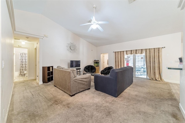 carpeted living room featuring ceiling fan and lofted ceiling