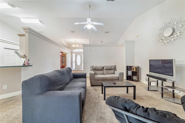 carpeted living room with ceiling fan with notable chandelier, crown molding, and vaulted ceiling