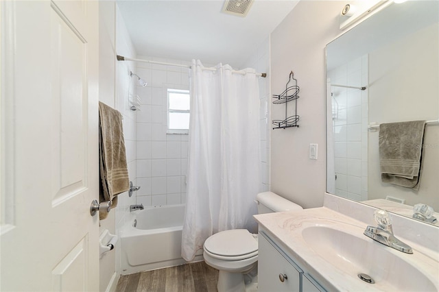 full bathroom with wood-type flooring, vanity, toilet, and shower / bath combo with shower curtain