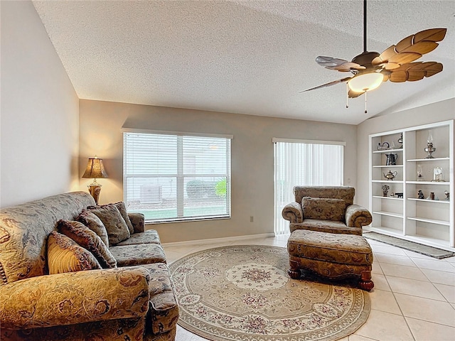 tiled living room with built in shelves, a textured ceiling, vaulted ceiling, and ceiling fan