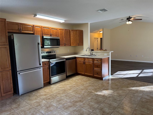 kitchen with ceiling fan, sink, light tile patterned floors, and appliances with stainless steel finishes