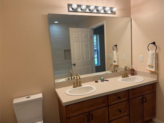 full bathroom with washtub / shower combination, vanity, and toilet