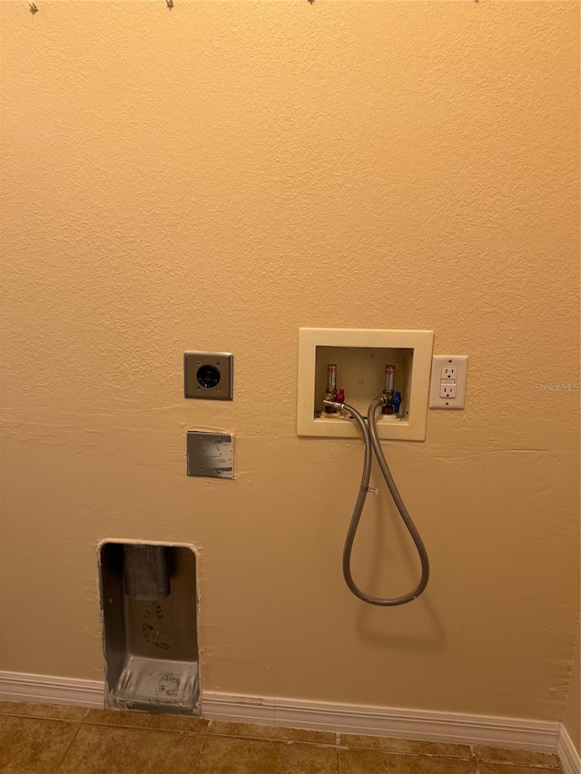 laundry area featuring washer hookup, tile patterned floors, and electric dryer hookup