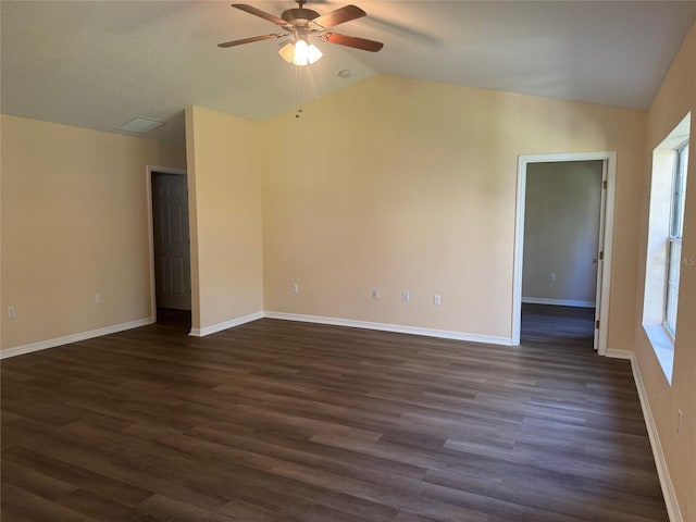 empty room with dark hardwood / wood-style floors, ceiling fan, and lofted ceiling