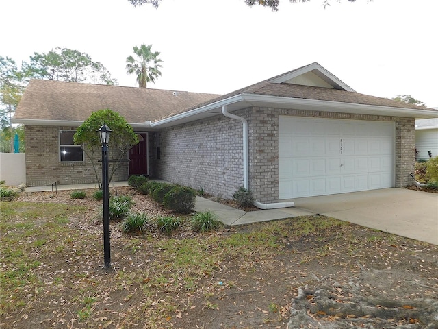 ranch-style house featuring a garage