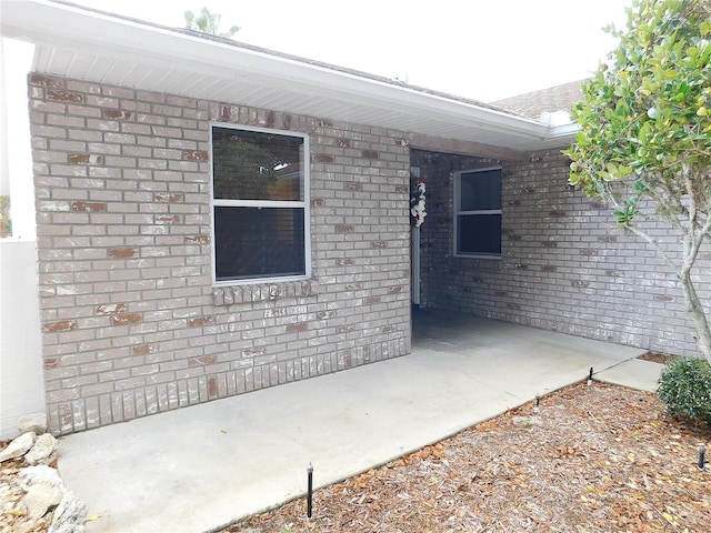 doorway to property featuring a patio area