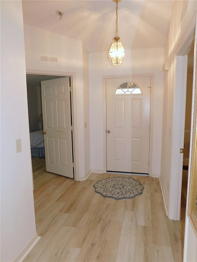 foyer with light hardwood / wood-style flooring