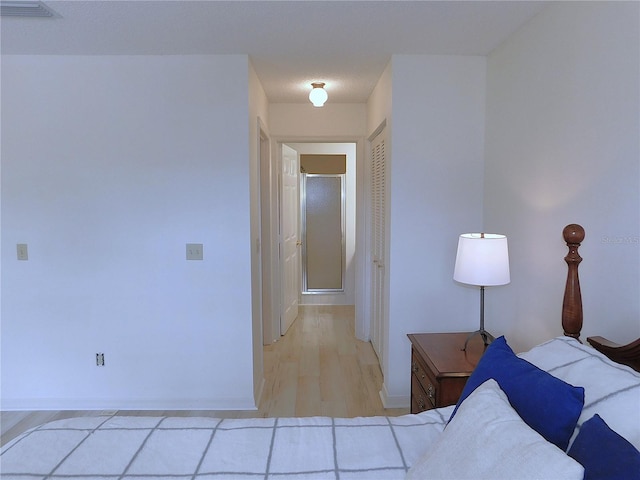 unfurnished bedroom featuring light wood-type flooring