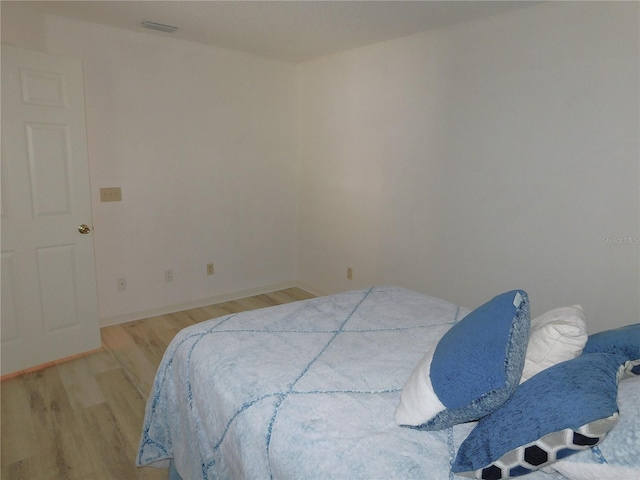 bedroom featuring light wood-type flooring