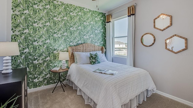 carpeted bedroom featuring multiple windows