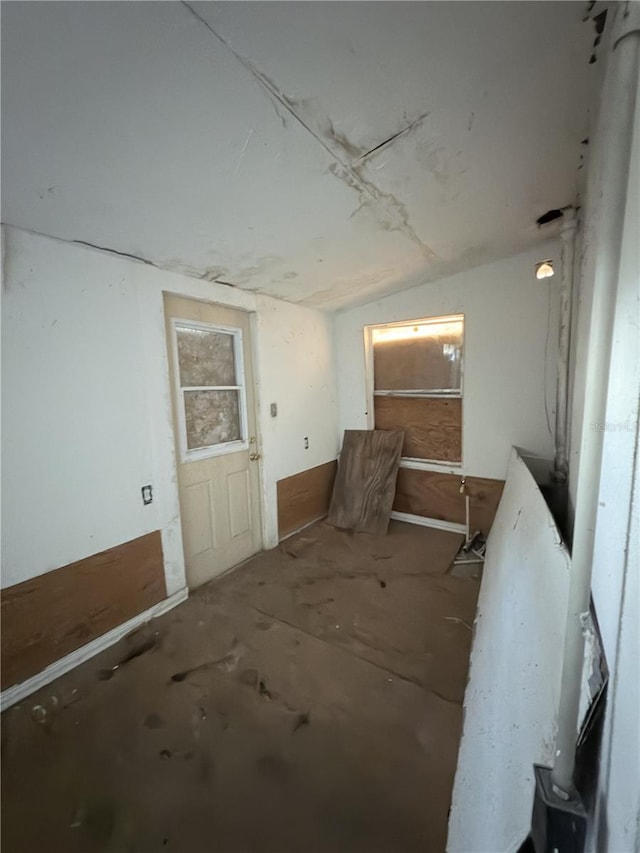 miscellaneous room featuring lofted ceiling