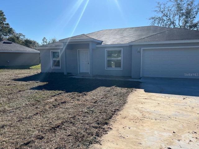 178 Pine Crse, Ocala, FL 34472 - single story home featuring stucco siding, an attached garage, and driveway