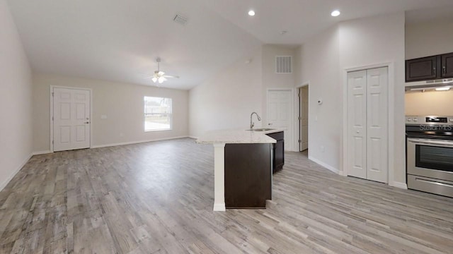 178 Pine Crse, Ocala, FL 34472 - kitchen featuring stainless steel range with electric stovetop, under cabinet range hood, a ceiling fan, light wood-style flooring, and recessed lighting