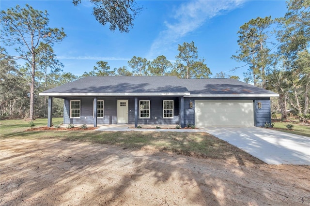 single story home with covered porch and a garage