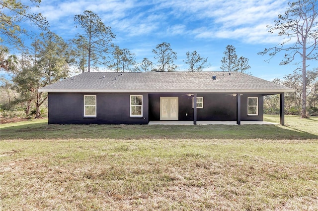 back of house with ceiling fan, a patio area, and a yard