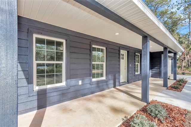 property entrance featuring covered porch