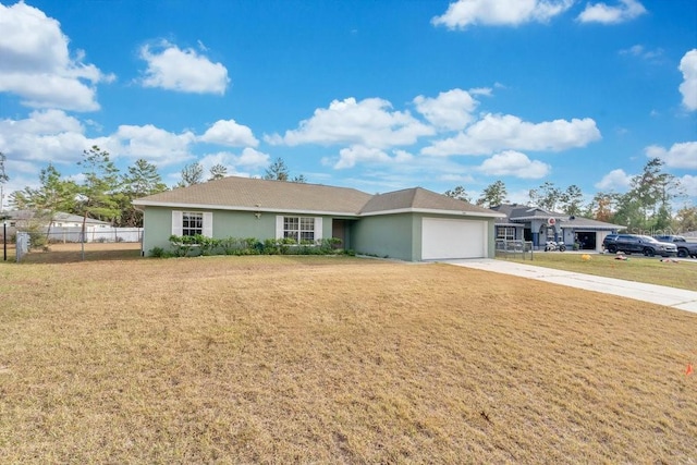 single story home with a garage and a front lawn