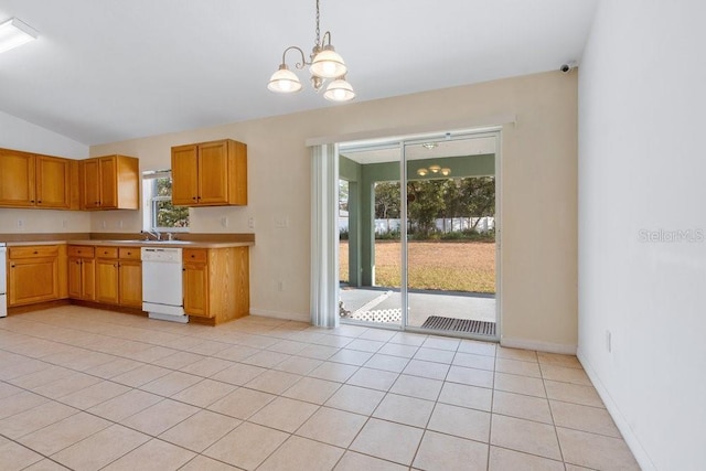 kitchen featuring dishwasher, vaulted ceiling, light tile patterned floors, decorative light fixtures, and a chandelier