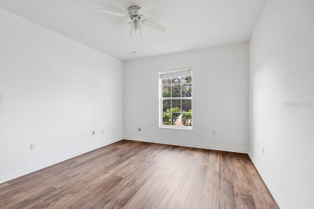 unfurnished room featuring wood-type flooring and ceiling fan