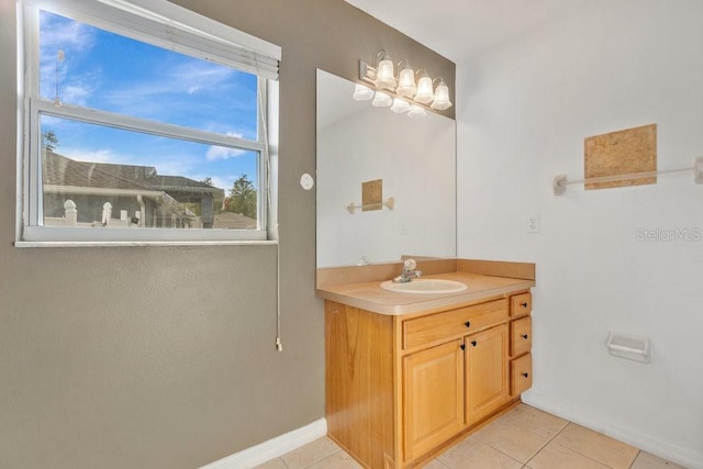 bathroom with tile patterned flooring and vanity