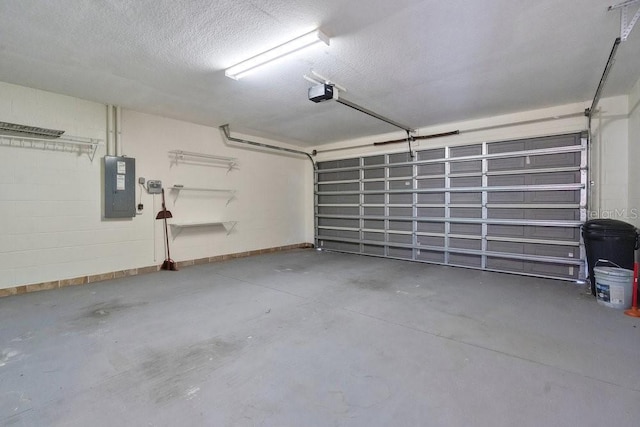 garage featuring electric panel and a garage door opener