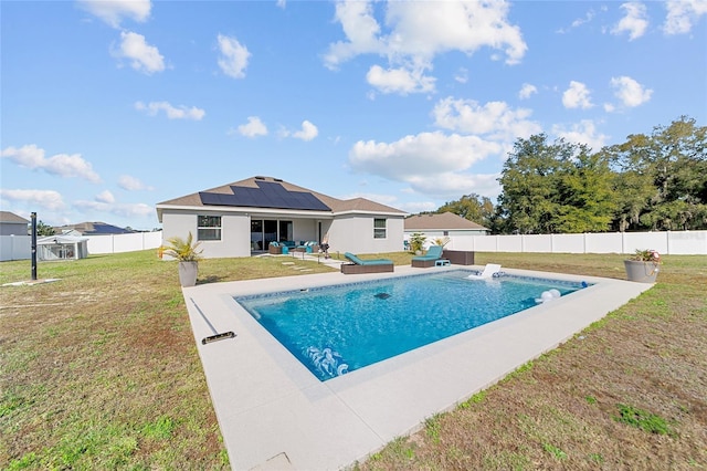 view of pool featuring a yard and a patio