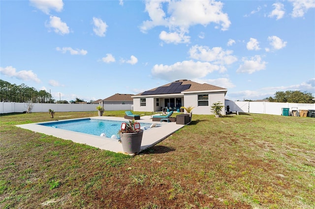 view of pool with a yard